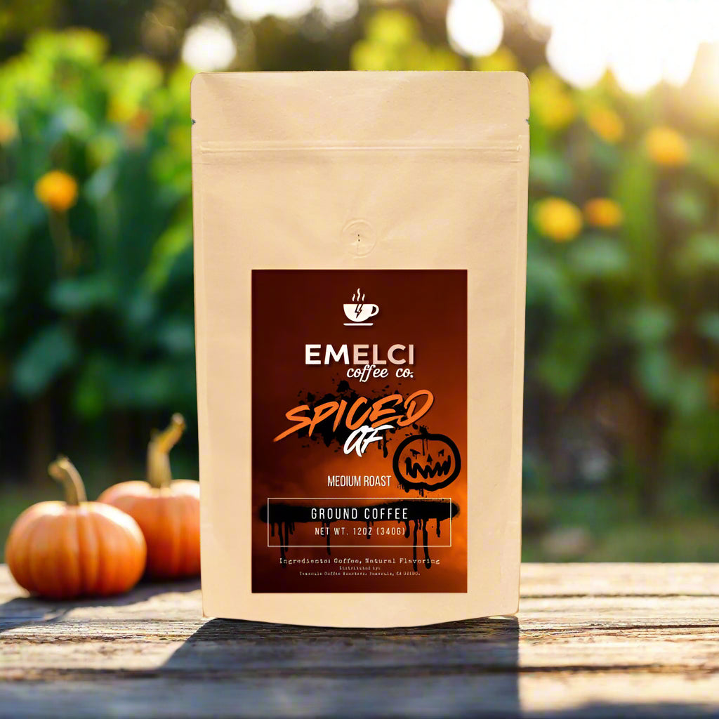 Emelci coffee bag with a spiced flavor label in front of pumpkins