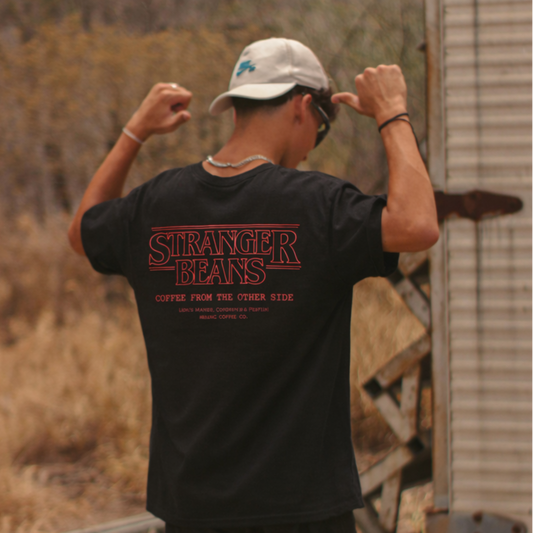 Person wearing a 'Stranger Things' t-shirt in an outdoor setting