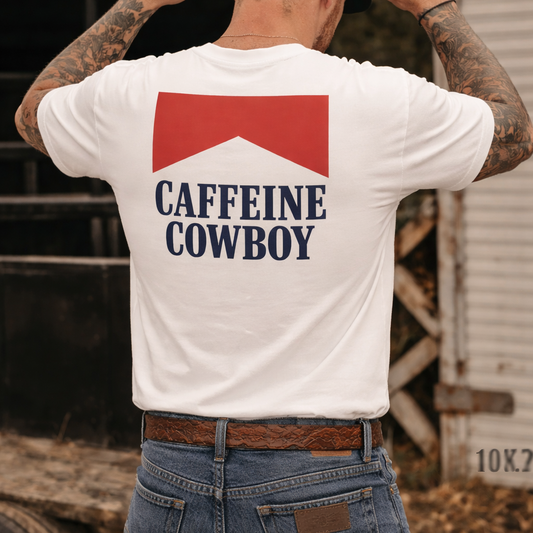 Man wearing a white t-shirt with 'Caffeine Cowboy' text, standing in front of a truck.