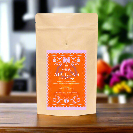 Kraft paper coffee bag with orange label on a white background