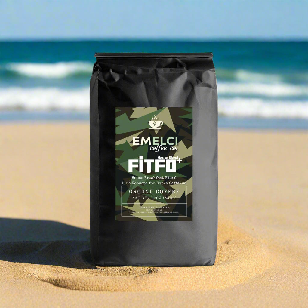 Black coffee bag with a camouflage label featuring 'Emelci Coffee Co.' on a white background