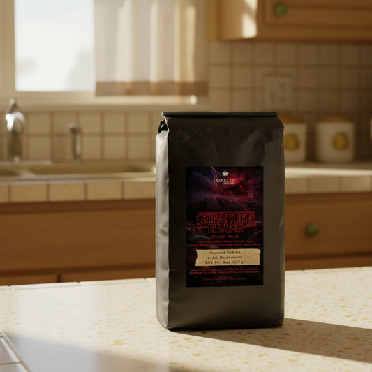 Black coffee bag with 'Stranger Beans' branding on a white background
