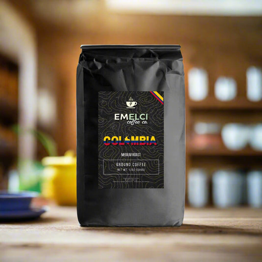 Black coffee bag with 'Emelci Coffee' label on a white background